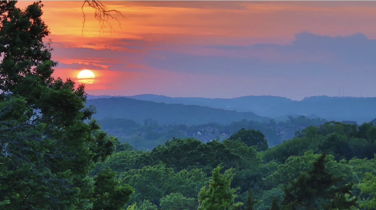 A colorful sunset over the Tennessee hills photographed by Kristal