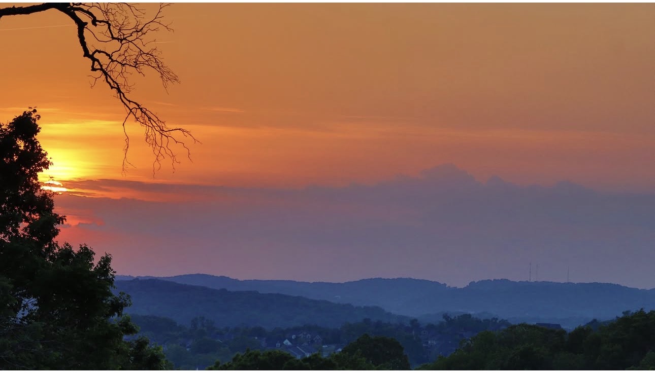 A glowing sunset over the Tennessee hills photographed by Kristal